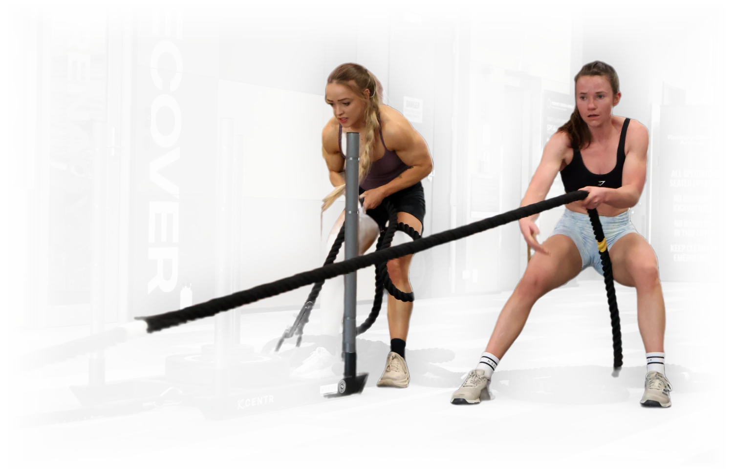 Two athletes on the sled pull in the Rodney Green Arenas foyer